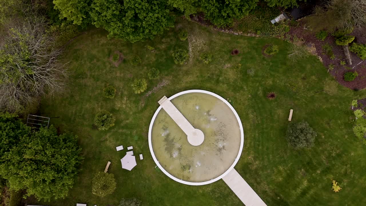 soft sunset glow reflects on gentle ocean waves and dark shoreline