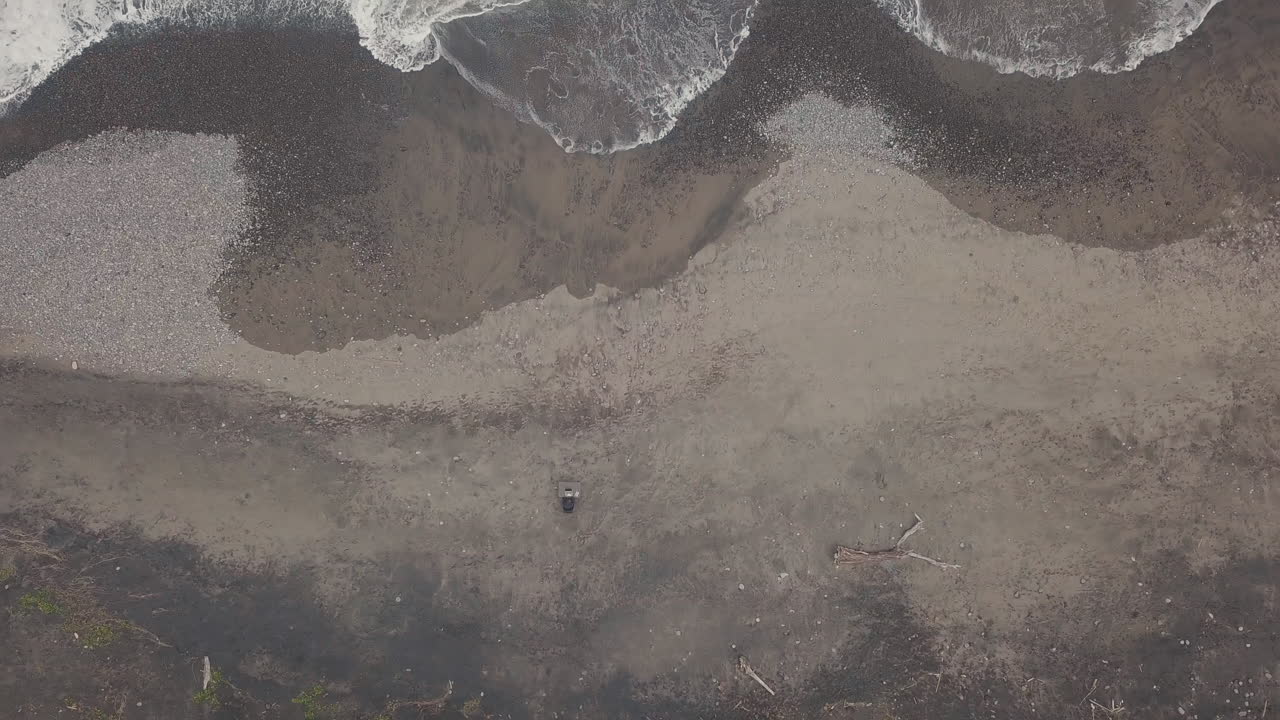 Top-View Of Lonely Man Working On Beach
