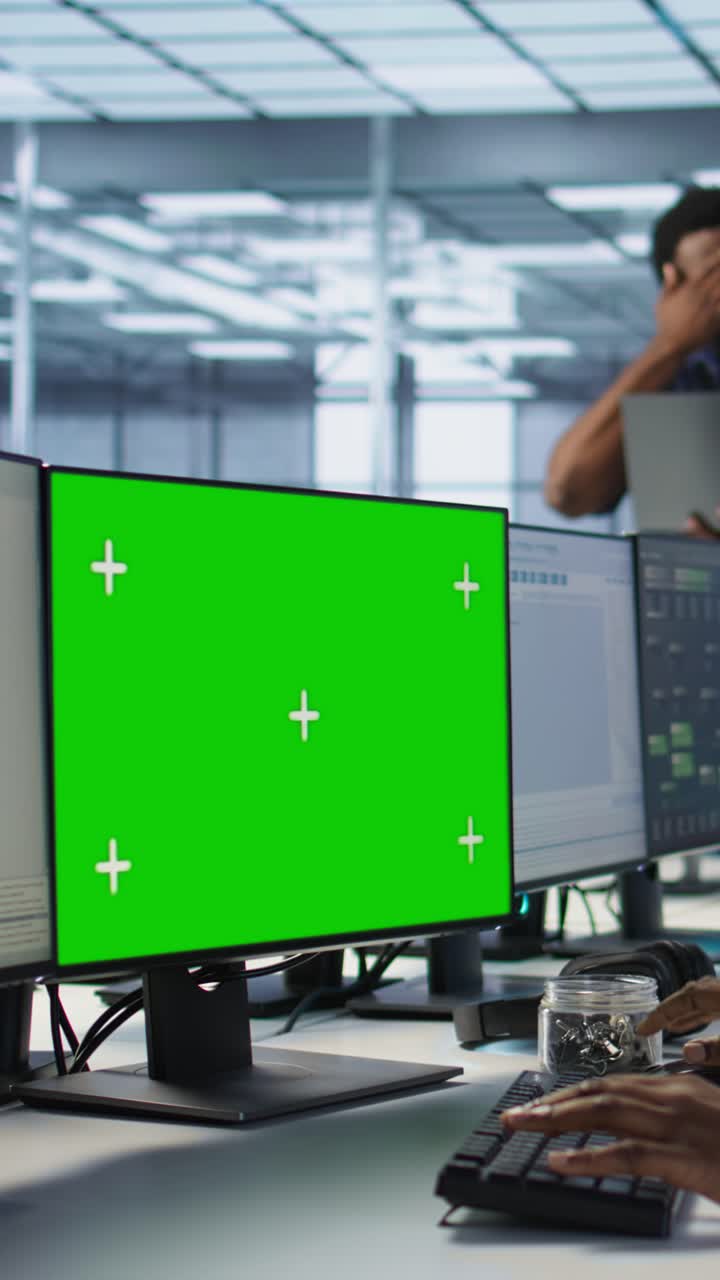 Vertical video Woman safeguarding data center against hackers with mockup computer