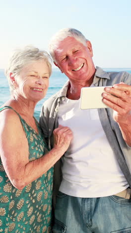 retired old couple taking selfie together