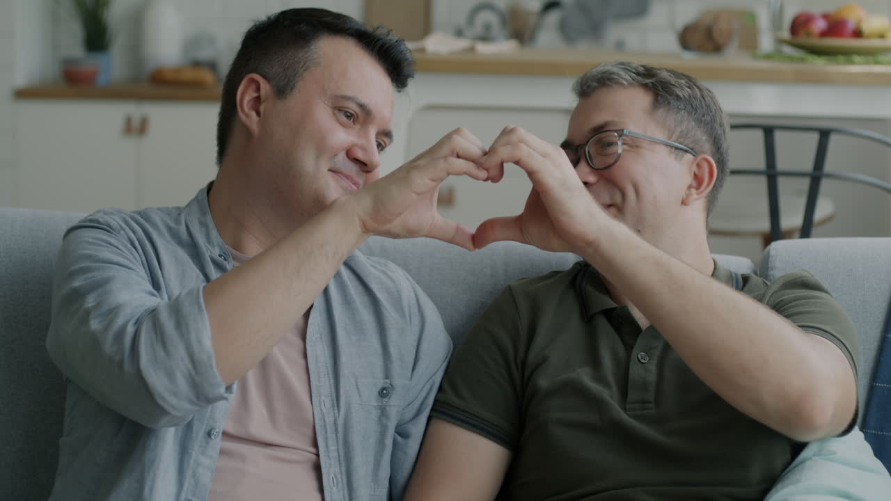 Happy Gay Couple Relaxing at Home