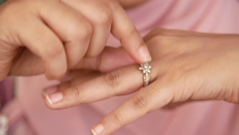 woman trying on a ring