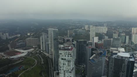 aerial flight above mexico city skyscraper high-rise buildings on cloudy, overcast day