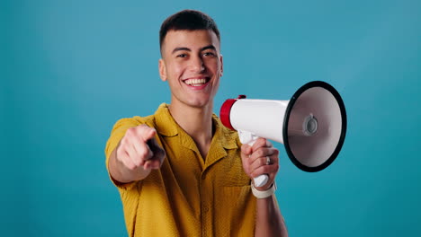 man with megaphone pointing at the viewer