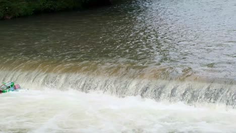 lots of plastic bottles in a mountain river lots of plastic bottles in a mountain river waterfall from plastic bottles