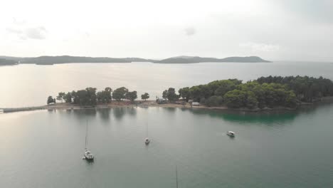 aerial: flying over the smal islands of koukoumitsa near vonitsa city greece