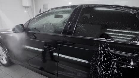 black auto in car wash