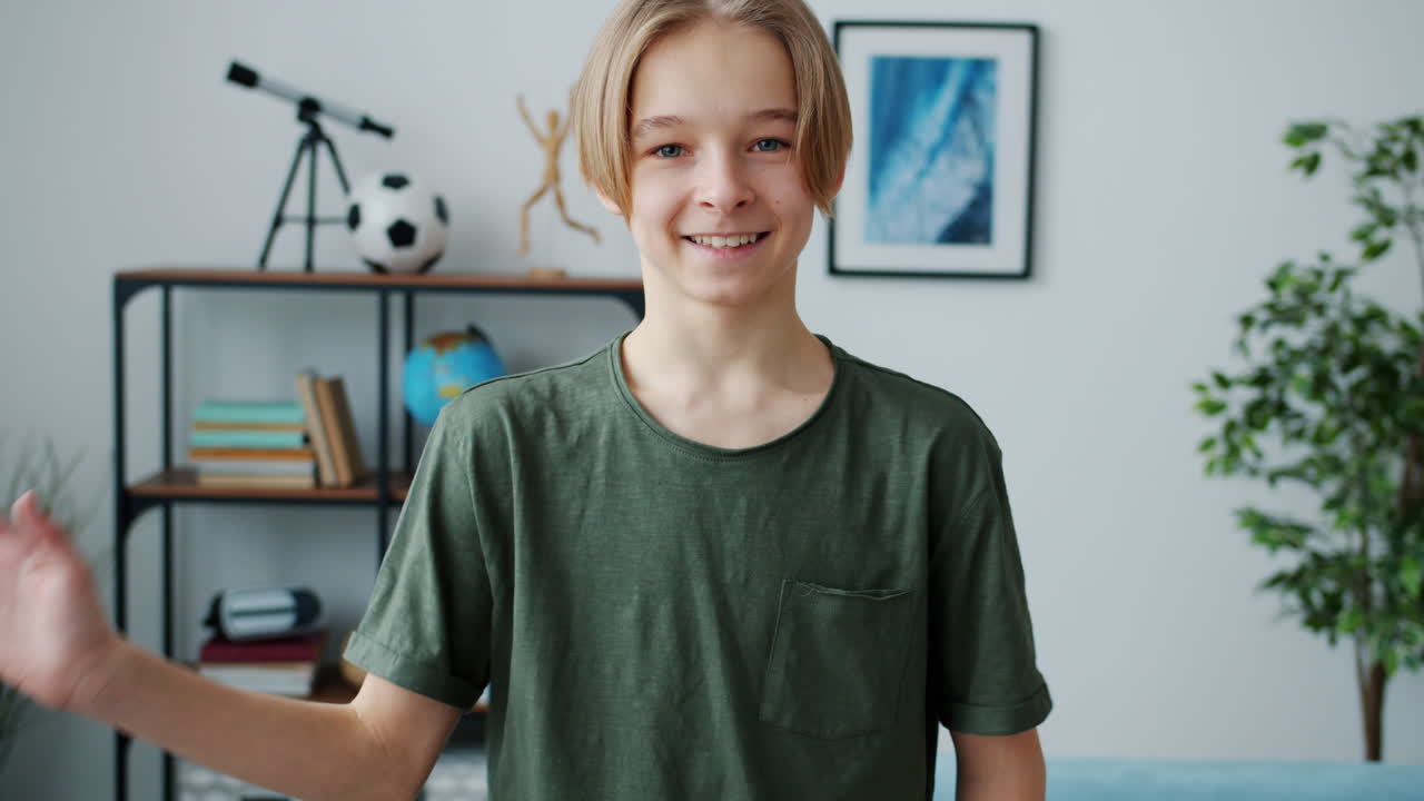 Smiling Teenager Waving