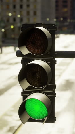 traffic signal pole at empty urban intersection during bright day