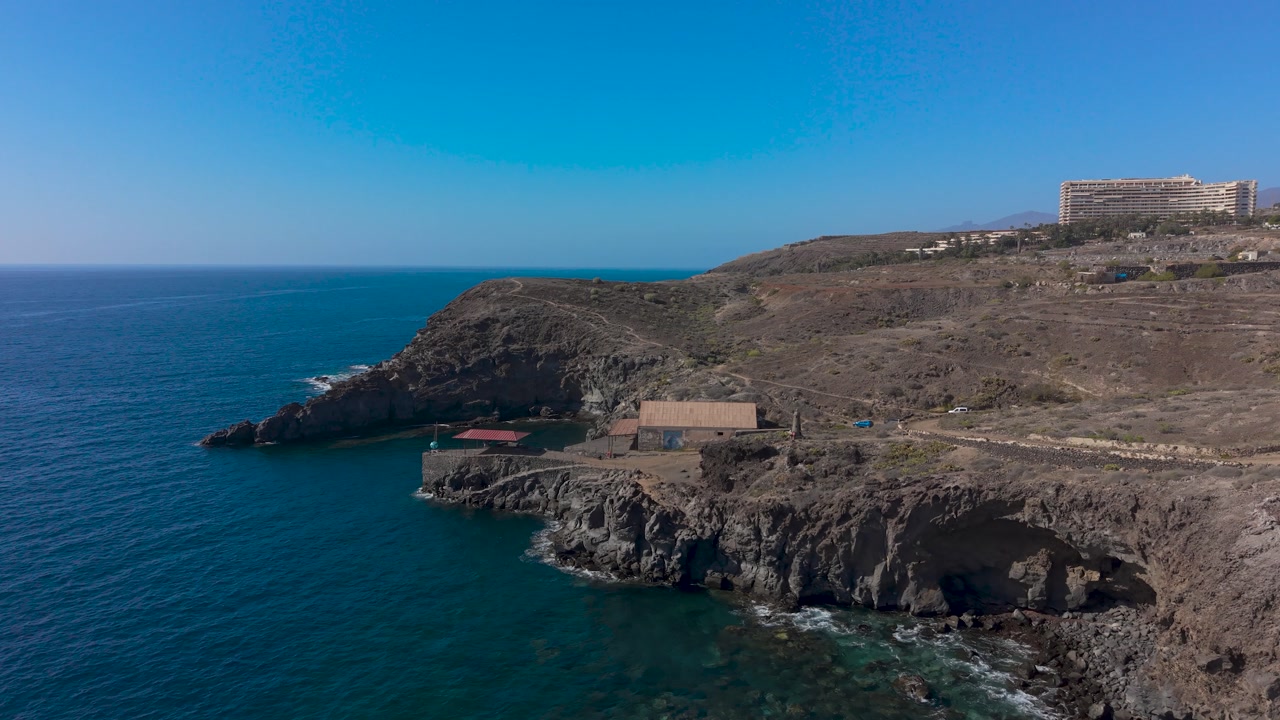 Dramatic volcanic coastline and blue sea in Tenerife, Canary Islands