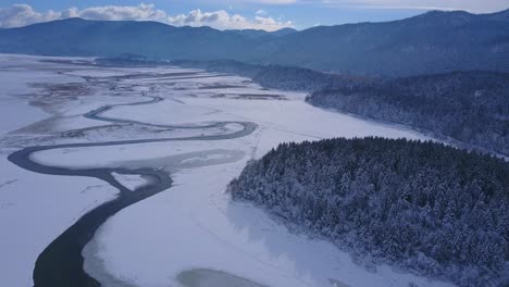 spring ice drift on the frozen winter river lake overflight - drone collection stock video