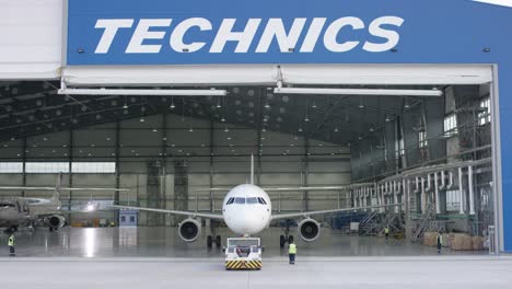 airplane maintenance in a hangar