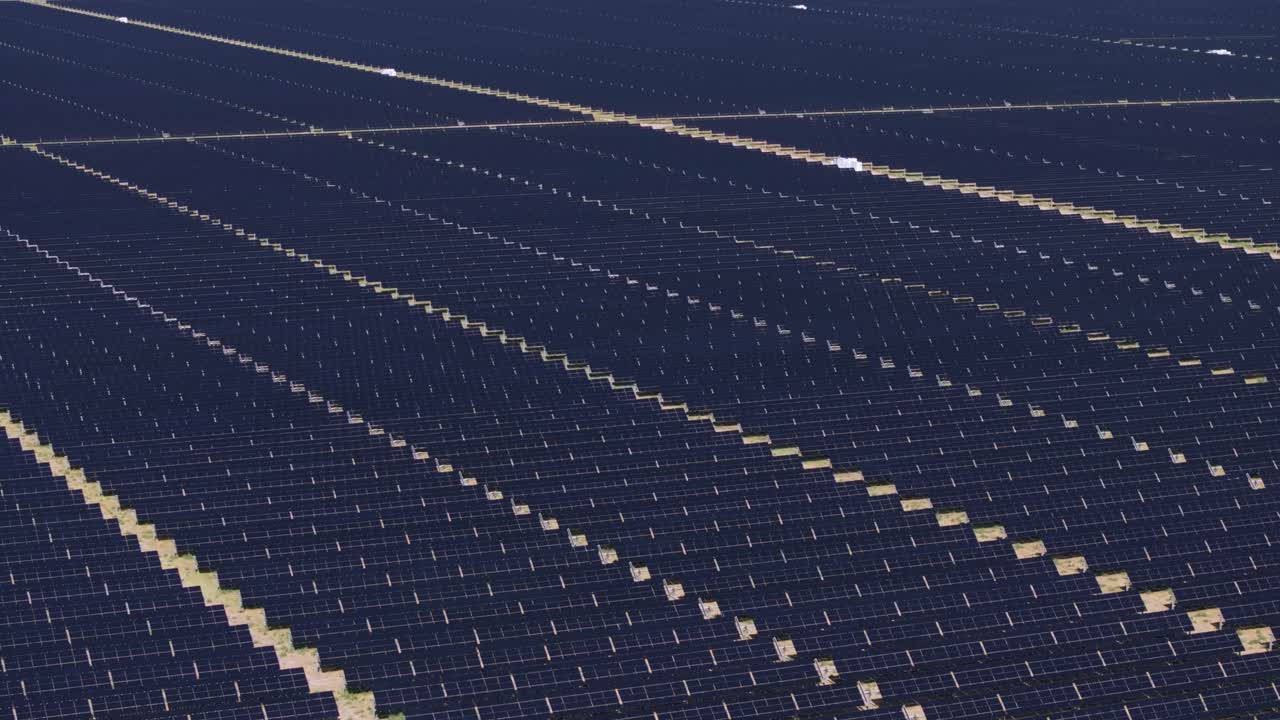 Aerial view of vast solar farm in Nevada, USA under clear sunny skies