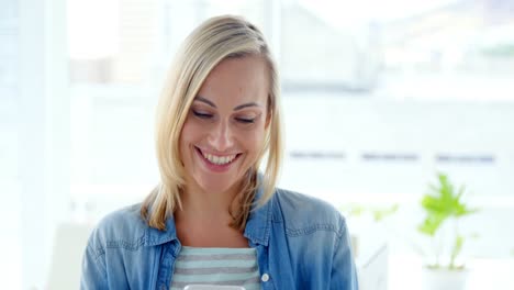 businesswoman text messaging on mobile phone