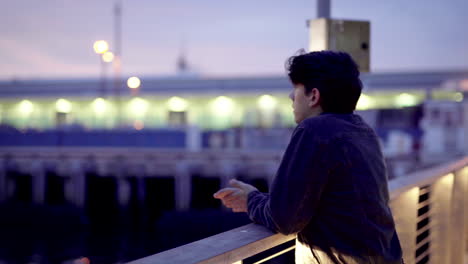Contemplative person near the ocean during sunset