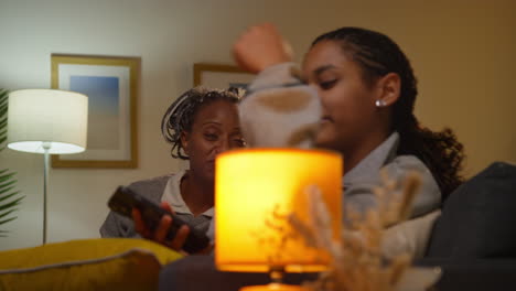 mother and daughter talking in the living room