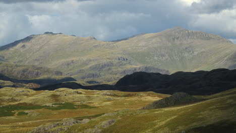 cloud shadows moving over rugged landscape and mountains