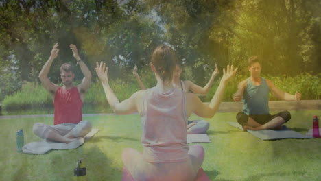 group practicing outdoor yoga on mats, showing floating health chart and heart icon animations