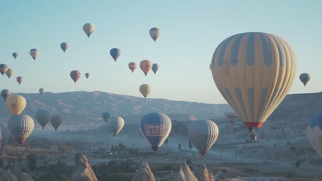 famous cappadocia hot air balloons flying at sunrise