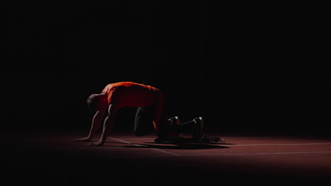 athlete in starting position for sprint race