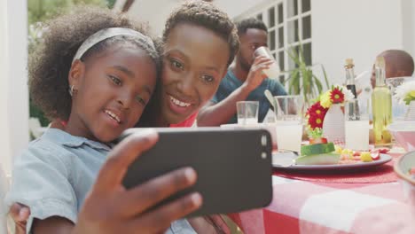 Happy-family-eating-together-at-table