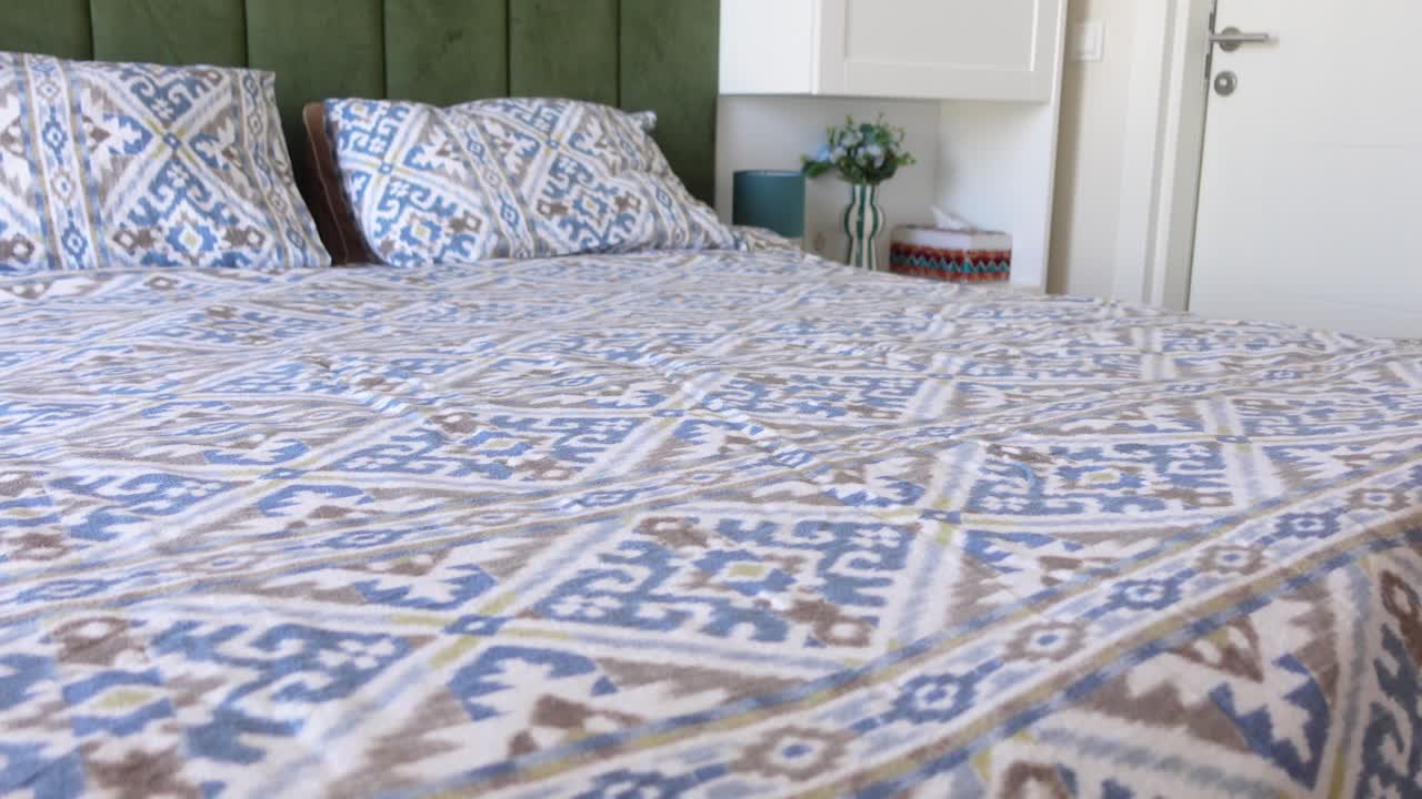 Bedroom with a Printed Bedspread