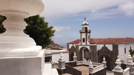 Cinematic-shot-revealing-the-CHURCH-OF-LA-CONCEPCIÓN-DE-VALVERDE-on-the-island-of-El-Hierro-and-on-a-sunny-day