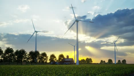 wind turbines standing in sunset. farm with wind turbines. generating clean renewable energy. bright orange sunset. alternative energy