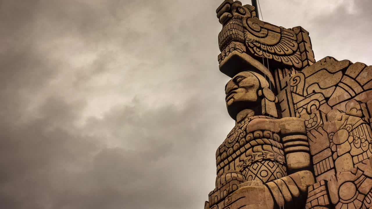 Ancient Statue under Cloudy Sky