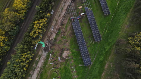 technician installing photovoltaic blue solar modules