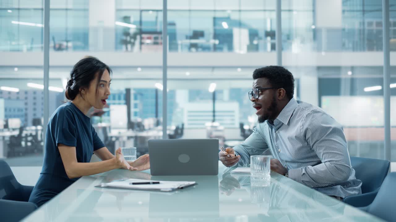 Multiethnic Diverse Office Conference Room Meeting: Team of Two Creative Entrepreneurs Talk, Discuss Growth Strategy. Stylish Young Businesspeople work on Investment in Real Estate and Commodities.