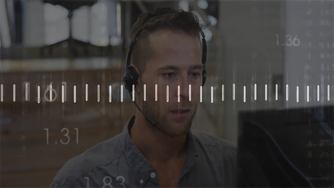 Man wearing headset working at computer with measurement scale overlay animation
