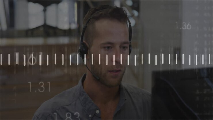Man wearing headset working at computer with measurement scale overlay animation