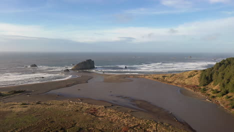 Aerial-flying-forward-of-mouth-of-river-Sixes-ending-in-Pacific-Ocean