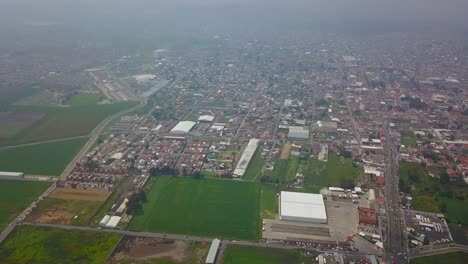 Aerial-view-of-agriculture-fields-close-to-Mexico-City,-and-around-the-volcanoes