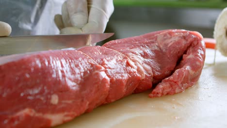 butcher tying meat with thread in shop 4k