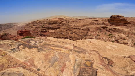 coming to the edge of the rock with a plain surface. glance on the sandstones of beautiful jordan, west asia.