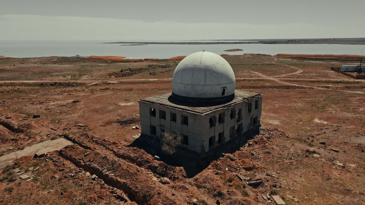 Aerial View of Abandoned Dome Building in Desolate Landscape
