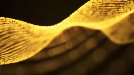 golden waves ripple elegantly in a mesmerizing display, showcasing smooth contours and dynamic light play. the abstract forms create a captivating visual experience full of movement and depth.