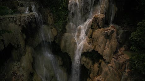 Drone-footage-of-a-mesmerizing-waterfall-surrounded-by-otherworldly-scenery