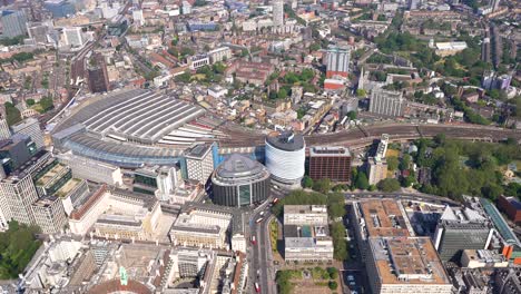 Aerial-view-from-Waterloo-railway-station-to-Lambeth-bridge,-passing-over-Archbishop's-Park,-London-UK