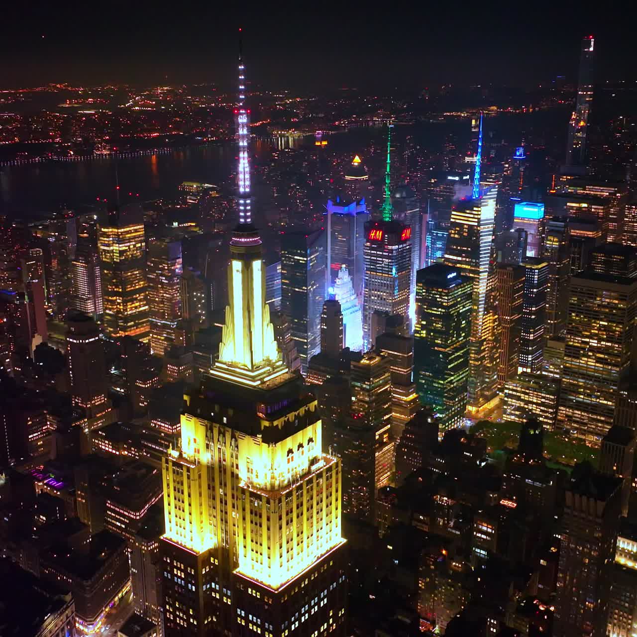 Stunning New York at night scenery. Eye-catching sight of vibrant metropolis at the backdrop of dark sky