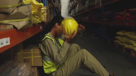 young female male worker in a warehouse