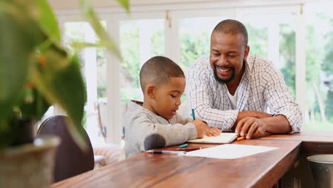 Father-helping-his-son-with-his-homework-4k