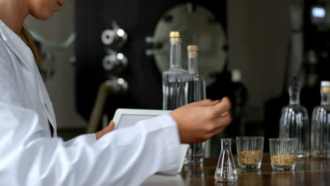 female worker using digital tablet in distillery factory 4k