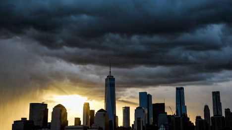dramatic storm clouds over a city skyline at sunset
