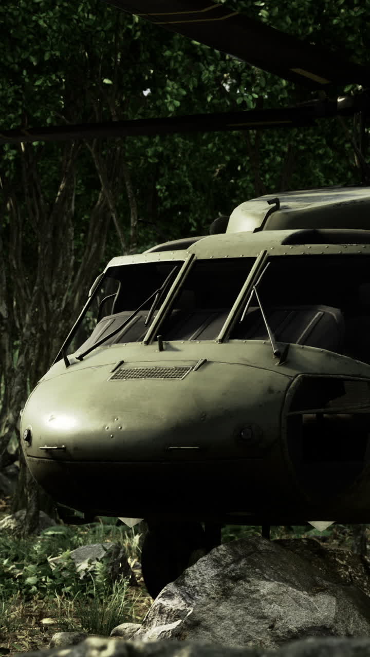 Military helicopter rests quietly in the dense forest during a stealth mission