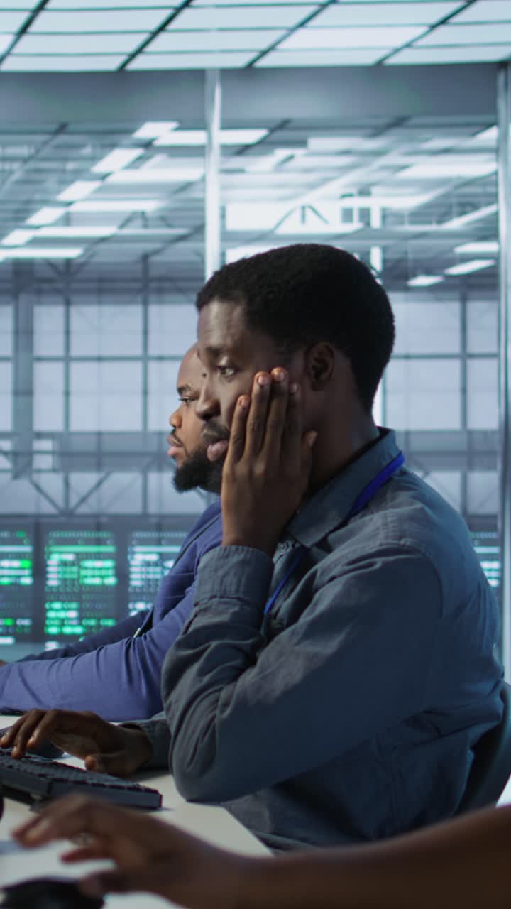 Vertical video Close up of woman in server hub ensuring optimal system performance