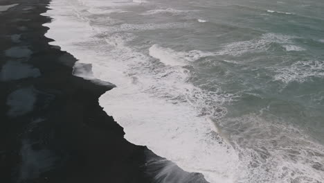 powerful waves on a black sand beach