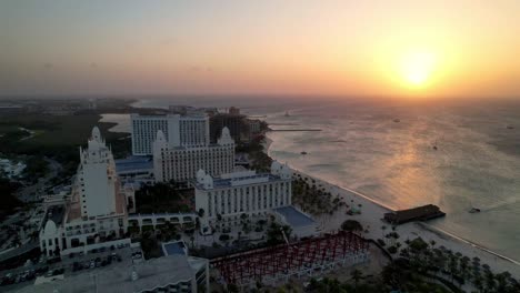 sunset aerial tilt up palm beach aruba